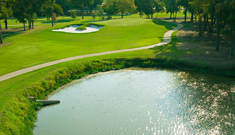 cart path next to a water hazard